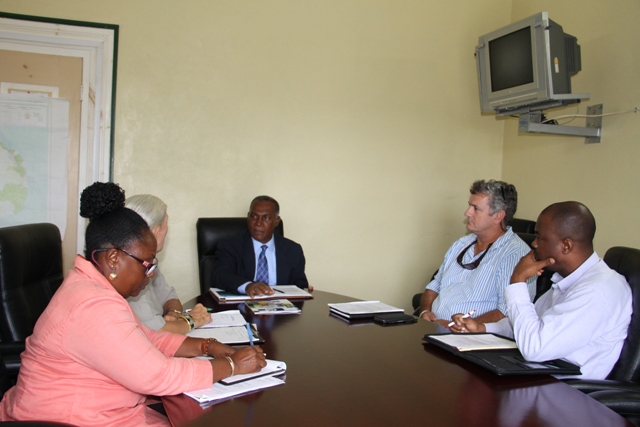 Premier of Nevis Hon. Vance Amory (at the head of the table) with (l-r) Vice President of the Nevis Chapter of the St. Kitts and Nevis Chamber of Industry and Commerce Patricia Claxton, Administrator Deborah Lellouch, Past Chairman Mark Theron and Treasurer Warren Moving at a meeting at the Nevis Island Administration’s conference room at Bath Hotel on March 08, 2016